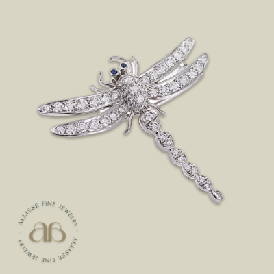 A diamond and sapphire dragonfly brooch by Tiffany & Co.