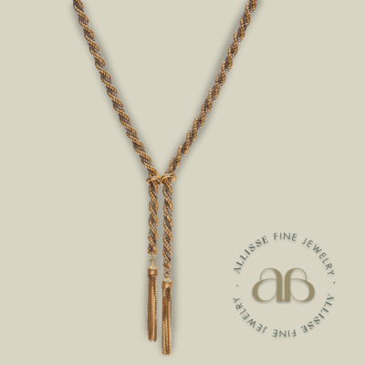 A gold lariat necklace
