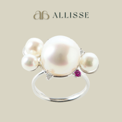 A pearl, sapphire and diamond cluster ring