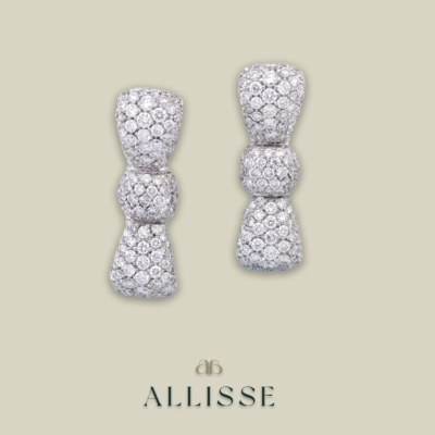 Pair of bow shaped white gold and diamond earrings