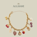 A gold charm bracelet by Catanachs